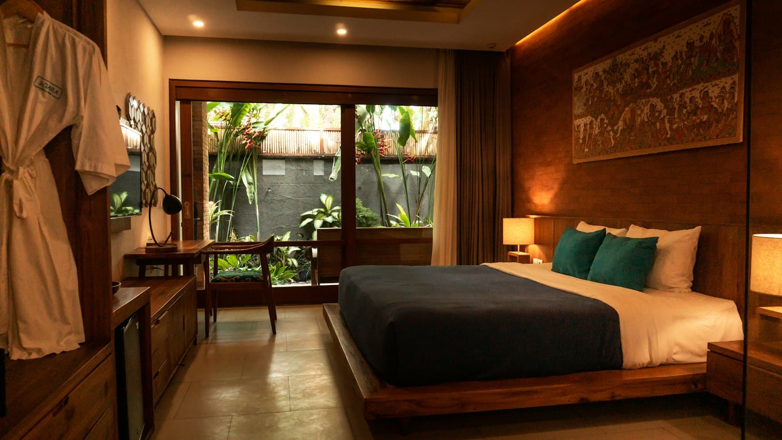 A wood-panelled room opening onto a garden courtyard