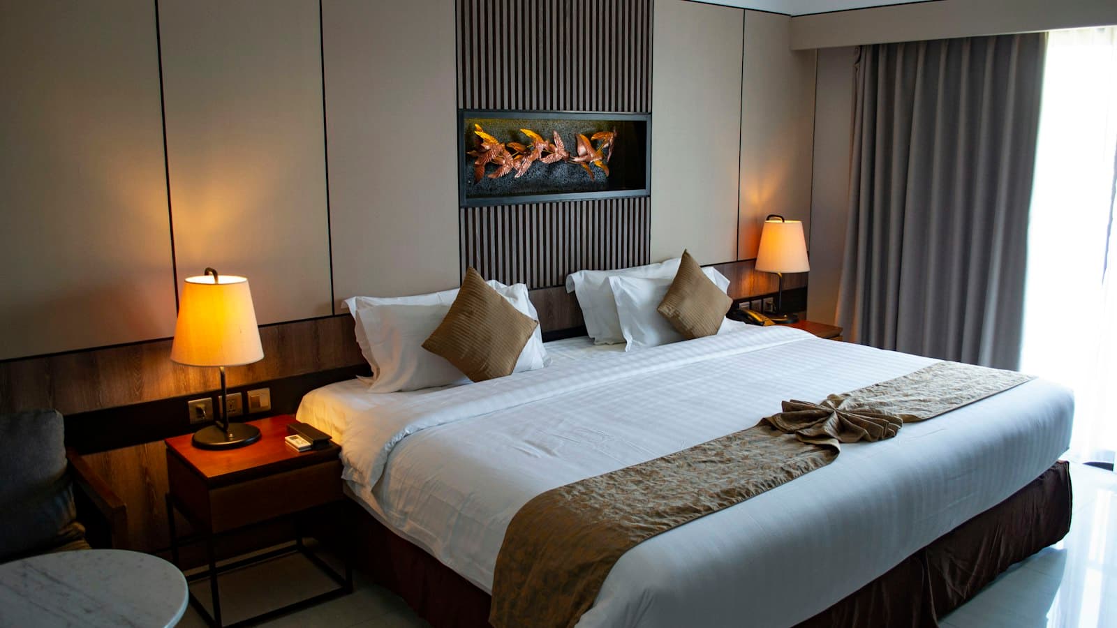 A twin room with two beds dressed in white linen